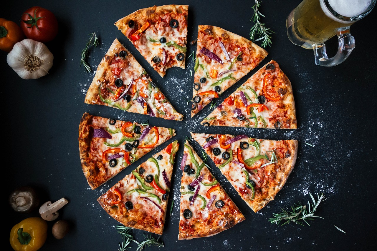 Photo of pizza and fresh vegetables